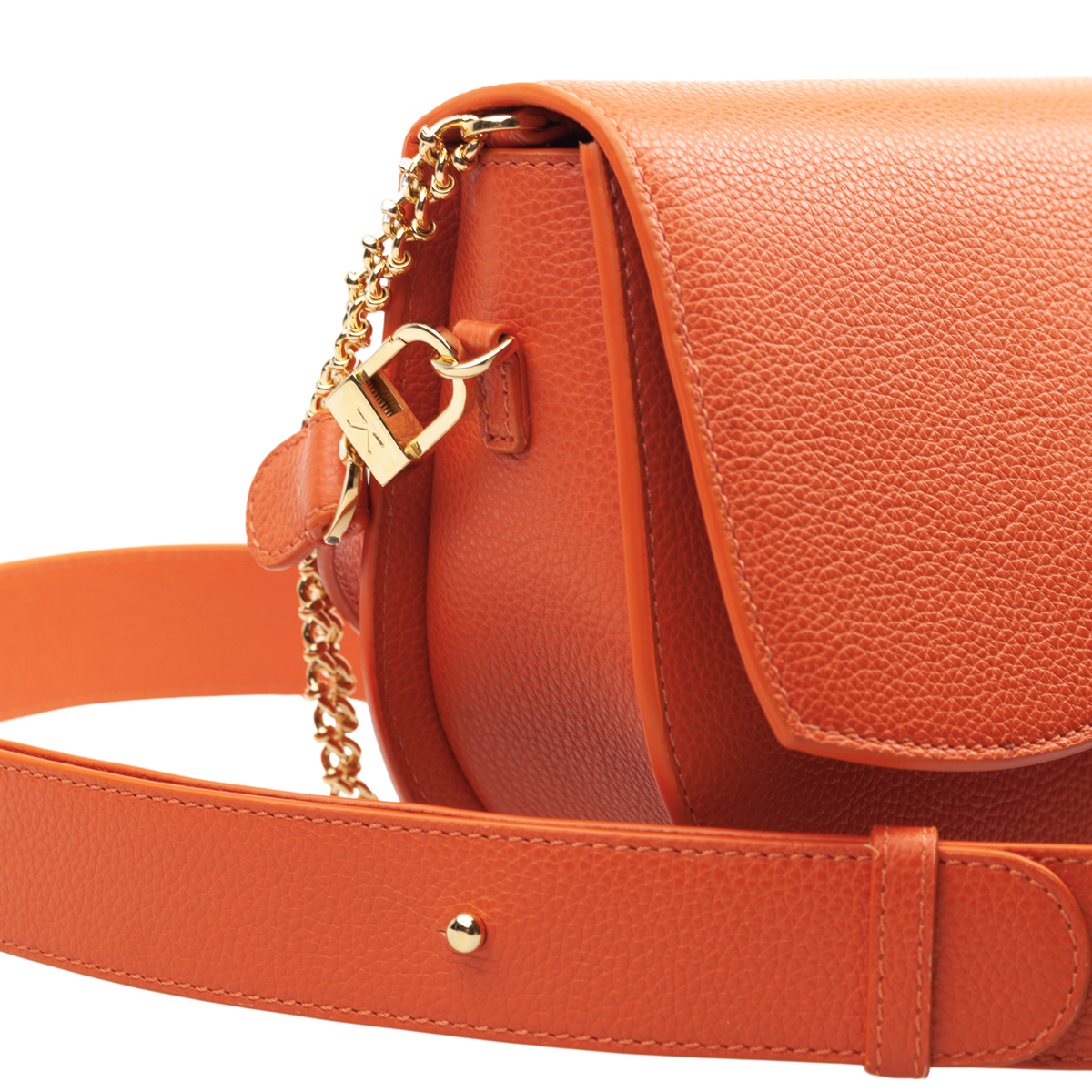 Ariana Wave Saddle, Pebble Leather Toasted Orange, Leather adjustable crossbody, Chain Shoulder Strap. 3/4 View Close Up