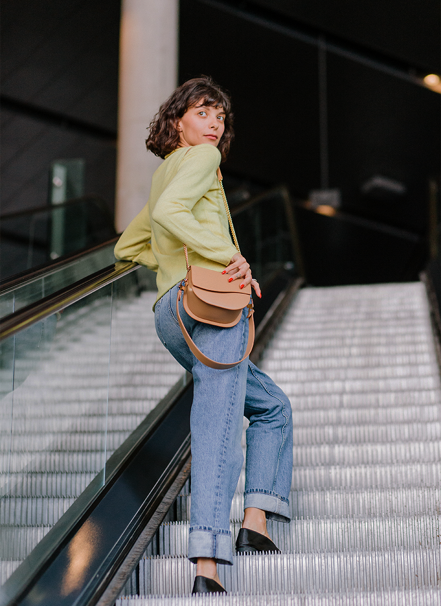 Ella Wave Saddle Bag in smooth Cappuccino worn as a crossbody