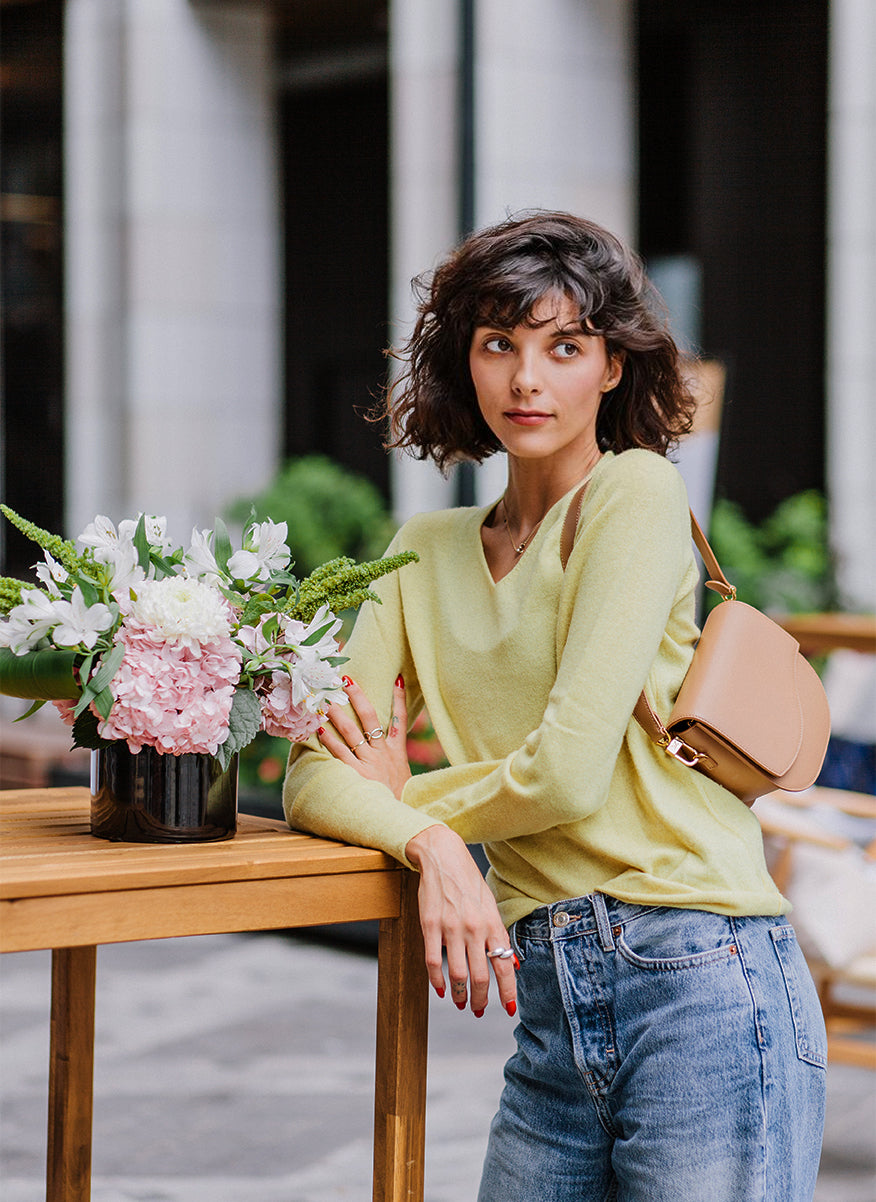 Ella Wave Saddle Bag in smooth Cappuccino worn as a shoulder bag