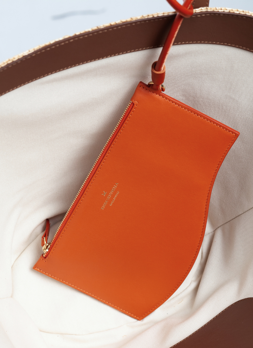 Marea Wave Pouch in Smooth Orange Leather, attached to tote bag.