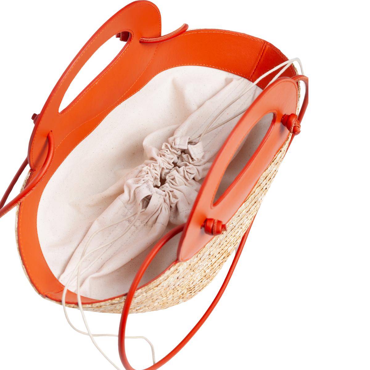 Interior: Interior of Marea Small Straw Bag showing canvas lining with drawstring closure.